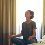 Disciplined - Woman Meditating In Bedroom