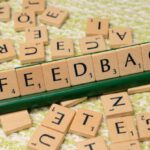 Constructive Feedback - The word feedback is spelled out with scrabble tiles